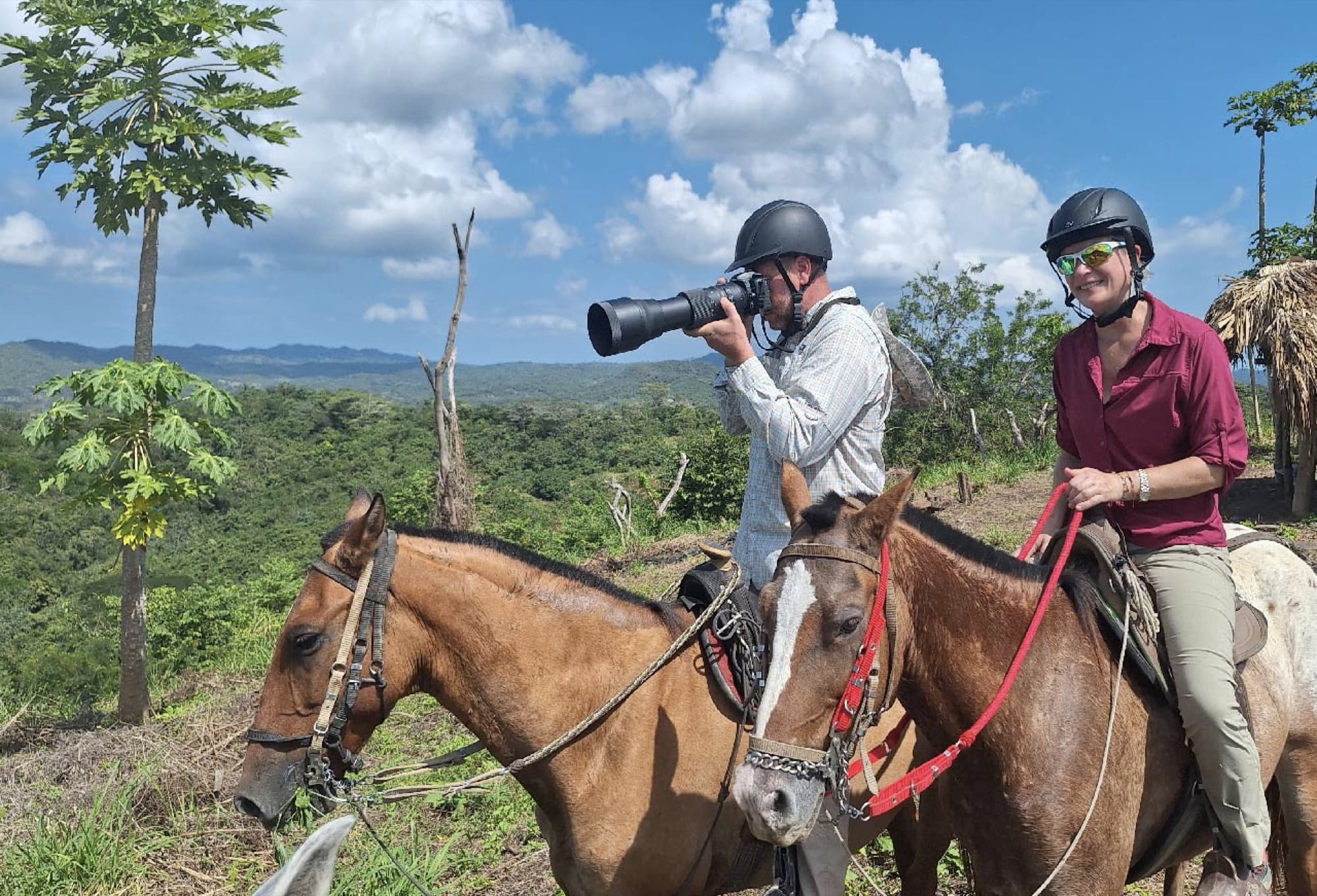 Horseback ride with birdwatching — visitor photographing with telephoto lens from a viewpoint
